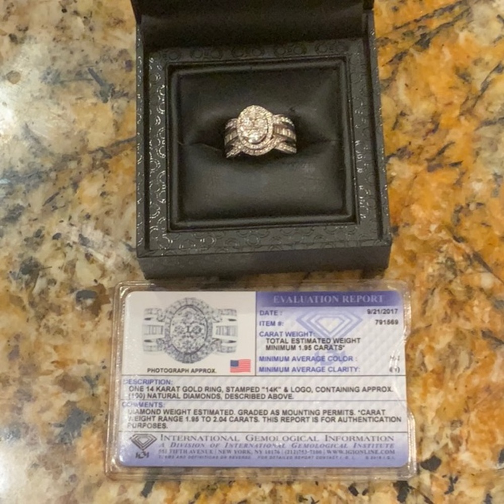 One 14 karat gold ring, 100 diamonds.
